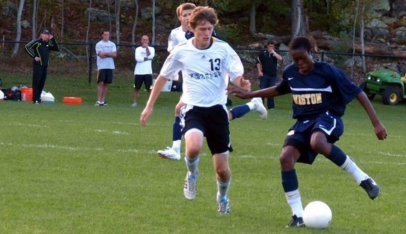 Joel Barlow senior Zachary Ozyck defends Weston freshman Simeon Okoro during a fall soccer game. 